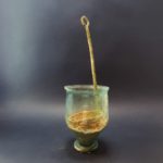Ancient Roman Glass Beakerfound with a bronze ladle stuck inside